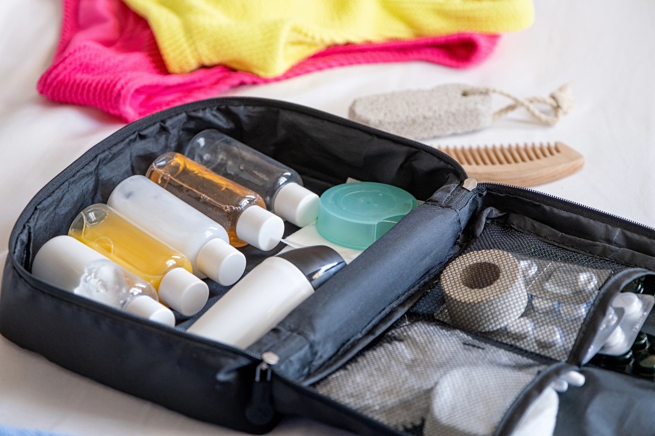 Travel cosmetics kit with bottles, pills and cosmetics